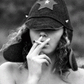Курящая девушка в будёновке